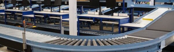 An image of a main conveyor with smaller infeed conveyors